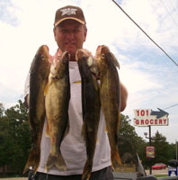 Man with nice stringer of Walleye from Norfork Lake