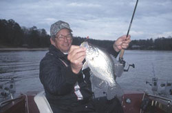 Man with crappie fish