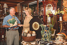 man and woman in antique shop