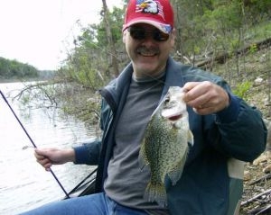 Fisherman holding Crappie fish