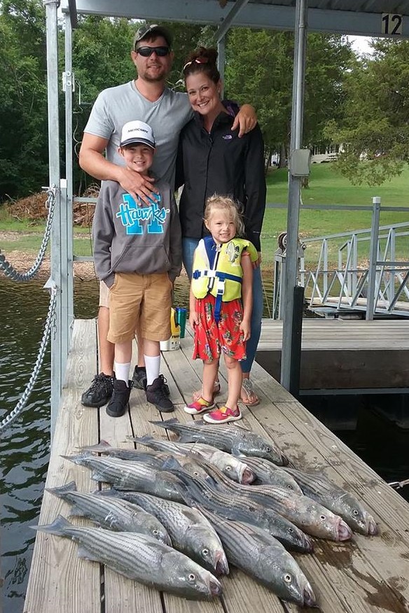 Family with large stringer of stripers