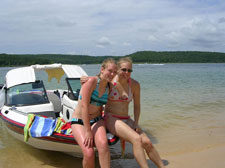 Two girls sitting on boat norfork Lake