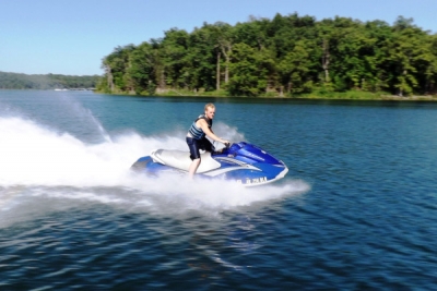 Teen jet skis on Norfork Lake