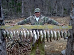 Fisherman with big stringer of bass from Norfork Lake