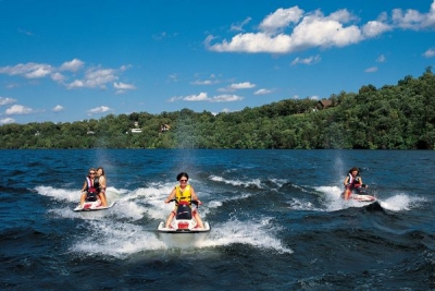 Jet skis race across Norfork Lake.