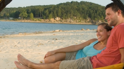 Couple camping on Sand Island at Norfork Lake
