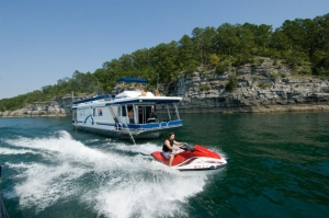 Houseboat and jet ski on Norfork Lake