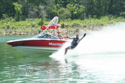 Boat and water skier on lake