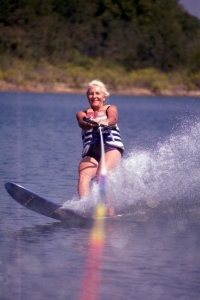 Woman wake boarding on Norfork lake