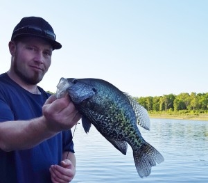 Fisherman with crappie Norfork Lake