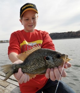 Boy with crappie fish on Norfork Lake