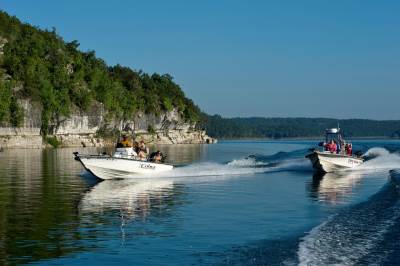 Boats zipping across Norfork Lake